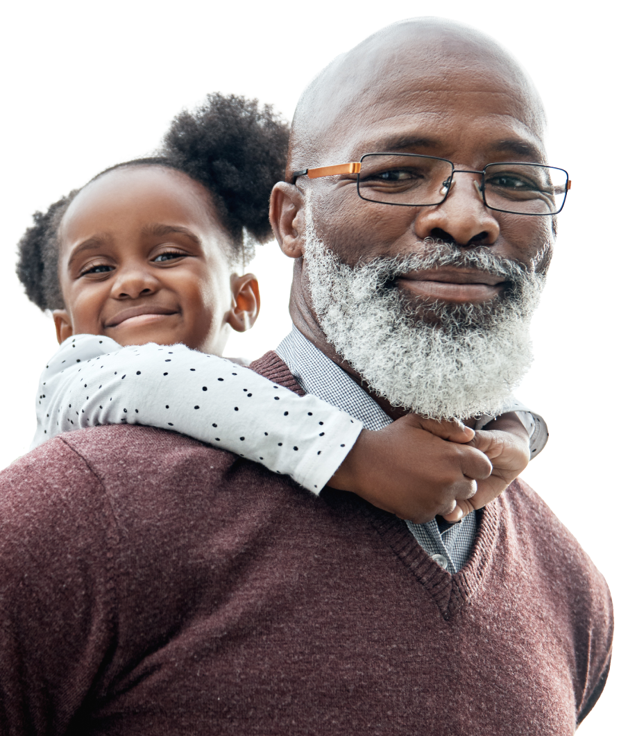 Older man carrying child on piggyback